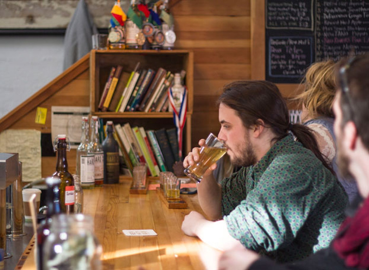 A man sitting at a bar.